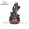 Quemador de incienso de cerámica Ganesh sentado en el escenario de loto